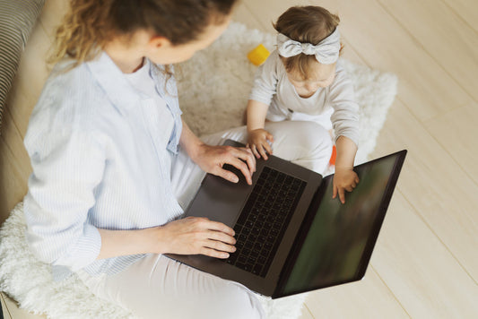 Mom and baby with a computer