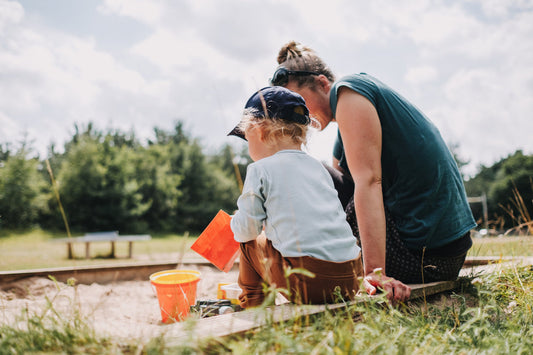 Mom and baby playing outdoors