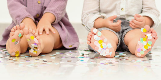 Children's feet and Carnival confetti