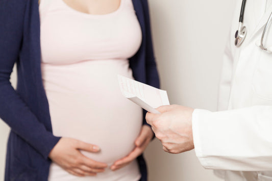 Pregnant woman at the doctor for a check-up. Find out the baby's birth date