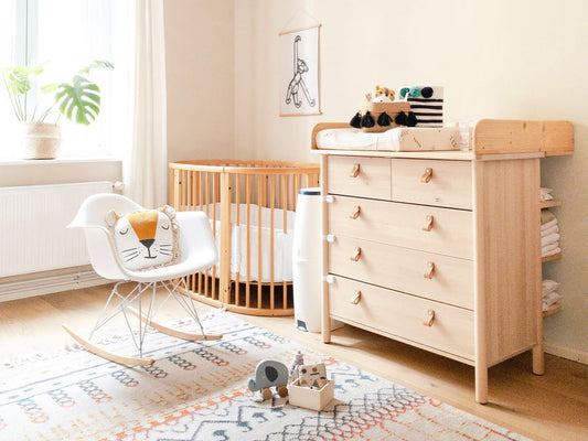 baby room with crib and changing table