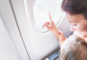 Young mother and her baby on an airplane