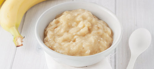 mashed banana in a small jar for baby