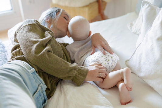 Mom with her baby in bed