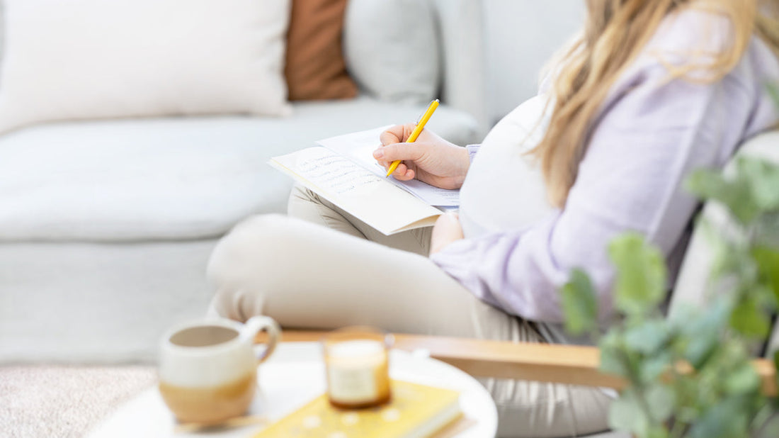 The woman is noting down baby names