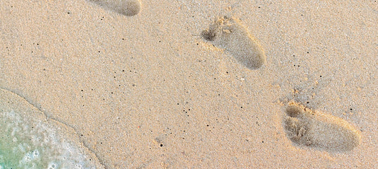 Baby foot prints in the sand