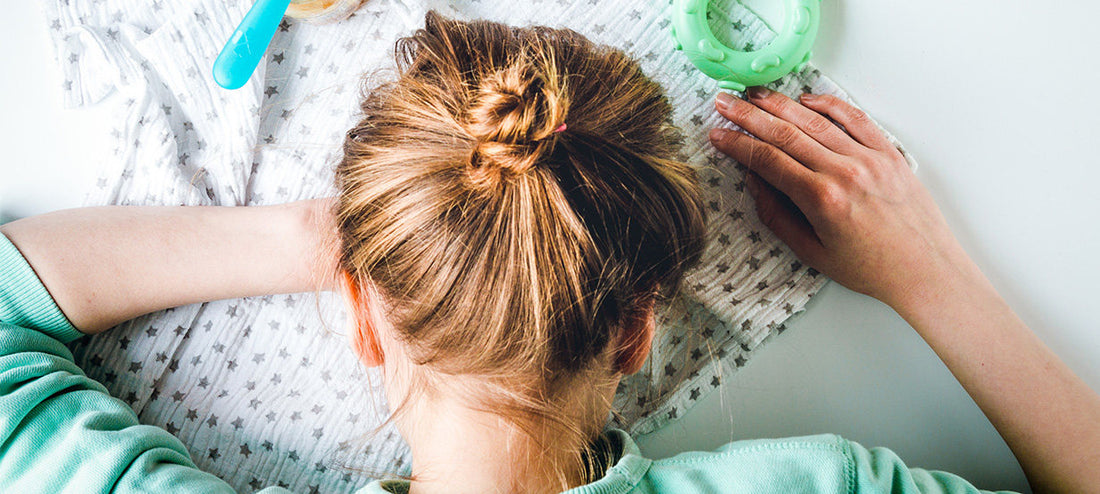 Mother fell asleep from sleep deprivation over the baby items.