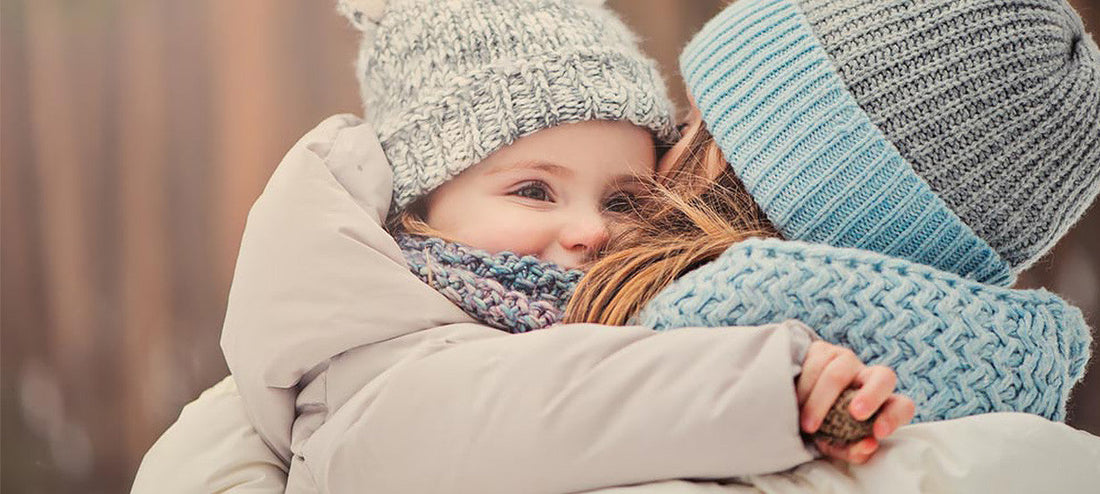 Mother and child in warm winter clothing outdoors