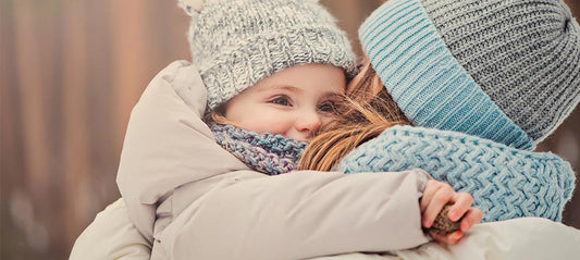 Mother and child in warm winter clothing outdoors