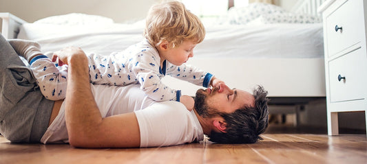 Father and son playing on the floor