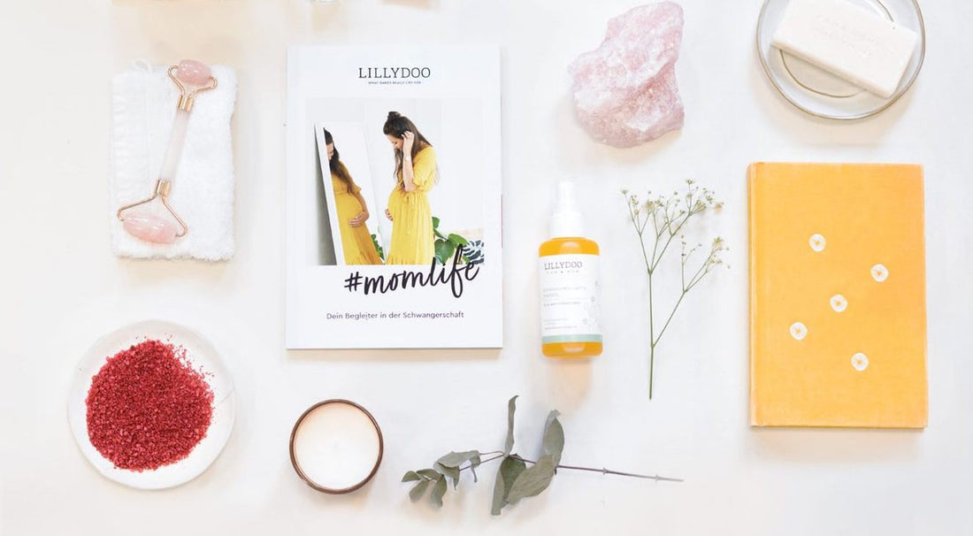 Various pregnancy must-haves spread out on a table