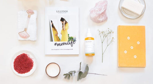 Various pregnancy must-haves spread out on a table