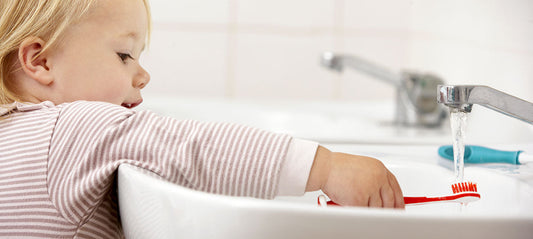 Little girl brushing her teeth